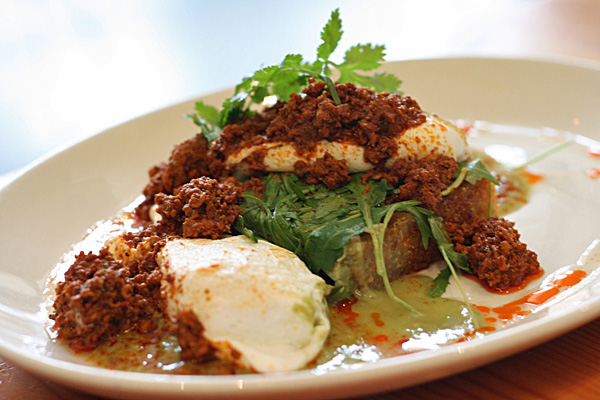 La Condesa - Huevos Chilangos: Wild boar chorizo, poached eggs, arugula, quinoa croquette, & avocado salsa