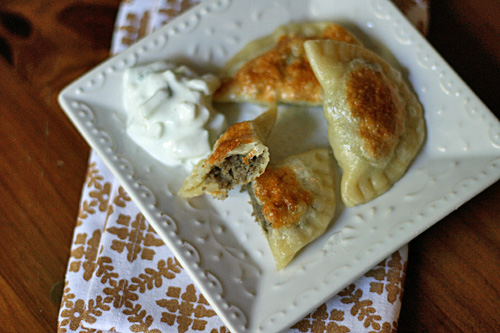 Pierogies - Lamb and potato pierogies are just the thing for dinner when fried and topped with a cucumber raita.