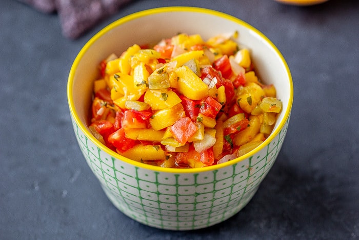 Roasted hatch peach salsa has the best of summer combined! Can a batch to savor all year.