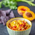 Roasted hatch peach salsa gives you spicy-sweet flavor that goes will with chicken, fish, pork, or just chips. Preserve it so you have the taste of summer all year long.