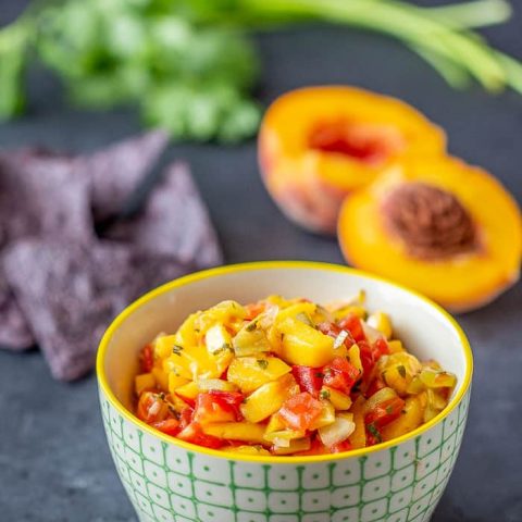 Roasted hatch peach salsa gives you spicy-sweet flavor that goes will with chicken, fish, pork, or just chips. Preserve it so you have the taste of summer all year long.