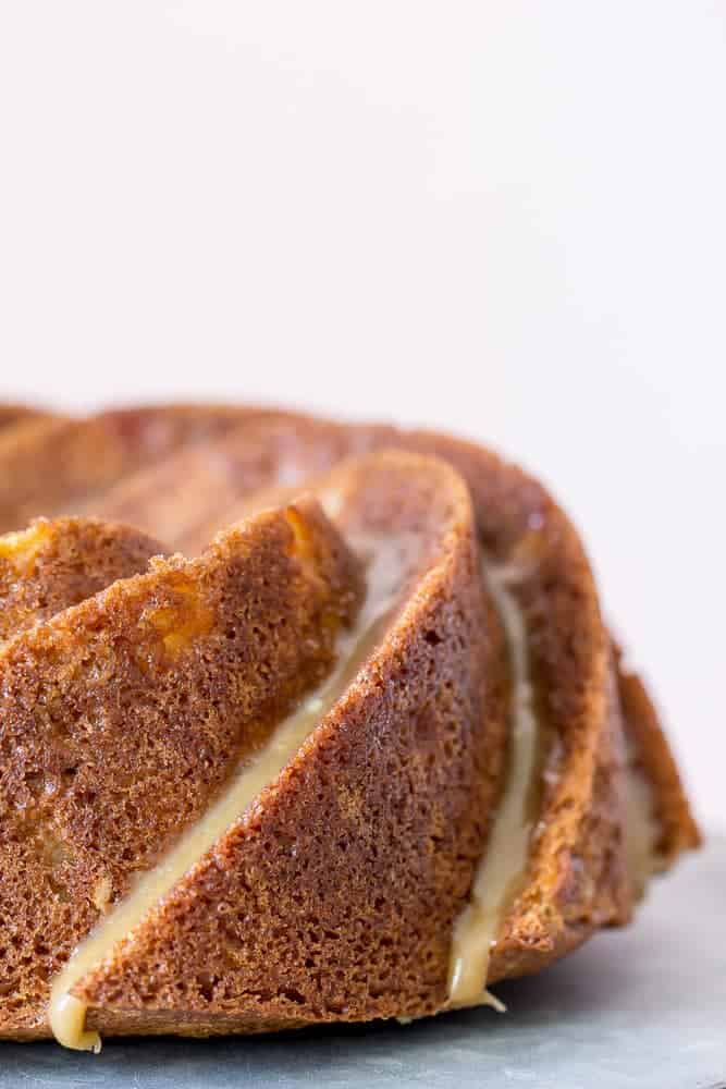 Spiced pear cake is tender and stuffed full of sweet pears, then topped with salted caramel glaze.