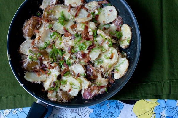 Skillet potatoes loaded with cheese, bacon, and more cheese. 