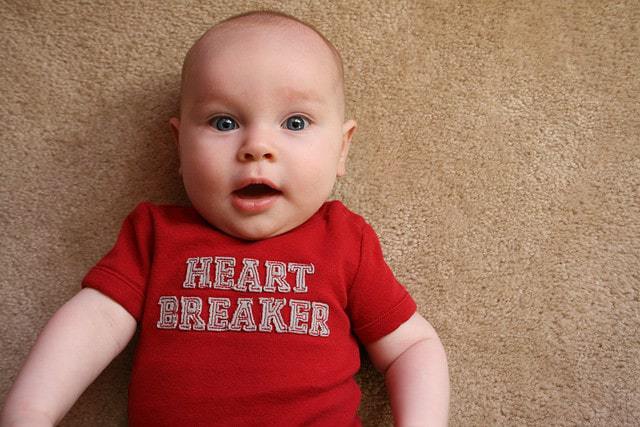 baby with valentine's onesie