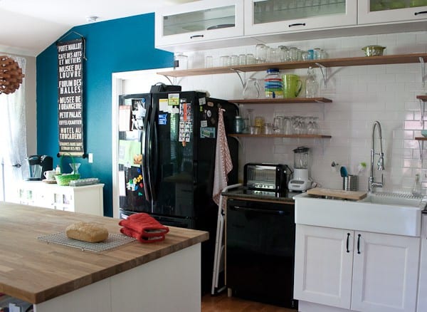 white kitchen with black appliances