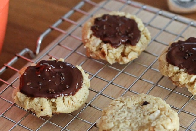 Chocolate Hazelnut Cookies - Reminiscent of pecan sandies, these hazelnut-studded cookies are topped with chocolate ganache before being finished with espresso salt. Chocolate Hazelnut Cookies - Reminiscent of pecan sandies, these hazelnut-studded cookies are topped with chocolate ganache before being finished with espresso salt.