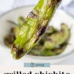 A hand holds a grilled shishito pepper above a bowl brimming with smoky, grilled shishito peppers; text below reads “grilled shishito peppers.”.