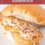 A sandwich with breaded, baked eggplant slices topped with melted cheese and tomato sauce on a hoagie roll, labeled "eggplant parmesan sandwich.