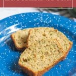 Three slices of easy zucchini bread on a blue speckled plate, with a text label "zucchini bread" at the top of the image.