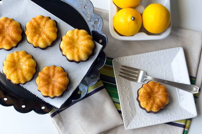 Mini Lemon Cakes with Chocolate Boots - Adorable mini lemon cakes are dipped in chocolate for a Puss in Boots-inspired treat.