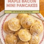 A plate of round maple bacon mini pancakes dusted with powdered sugar, with a fork on the side, makes for an irresistible stack of mini pancakes perfect for breakfast or brunch.