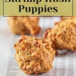 Shrimp hush puppies on a plate with the text how to make fried shrimp hush puppies for breakfast.