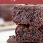 Stack of three thick, fudgy brownies on a white surface, with the text "fudgy brownies" above and "stetted.com" at the bottom—perfect for any chocolate lover.