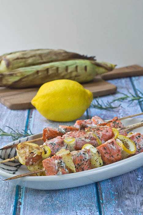 Salmon Kebabs are flavored with fresh lemon and herbs and are ready in a flash for a weeknight meal.