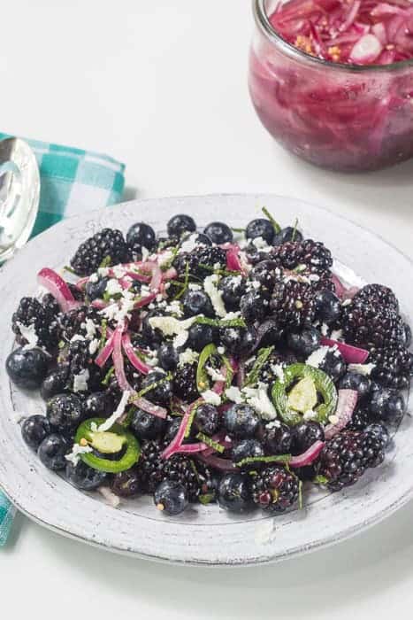 Blackberry Salad - Blue- and Blackberry Salad with pickled onions, cojita cheese, and jalapeños kick up the summer fruit salad selection.