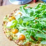 Zucchini crust pizza is gluten free but not free of flavor! It's a wonderful way to use up zucchini.