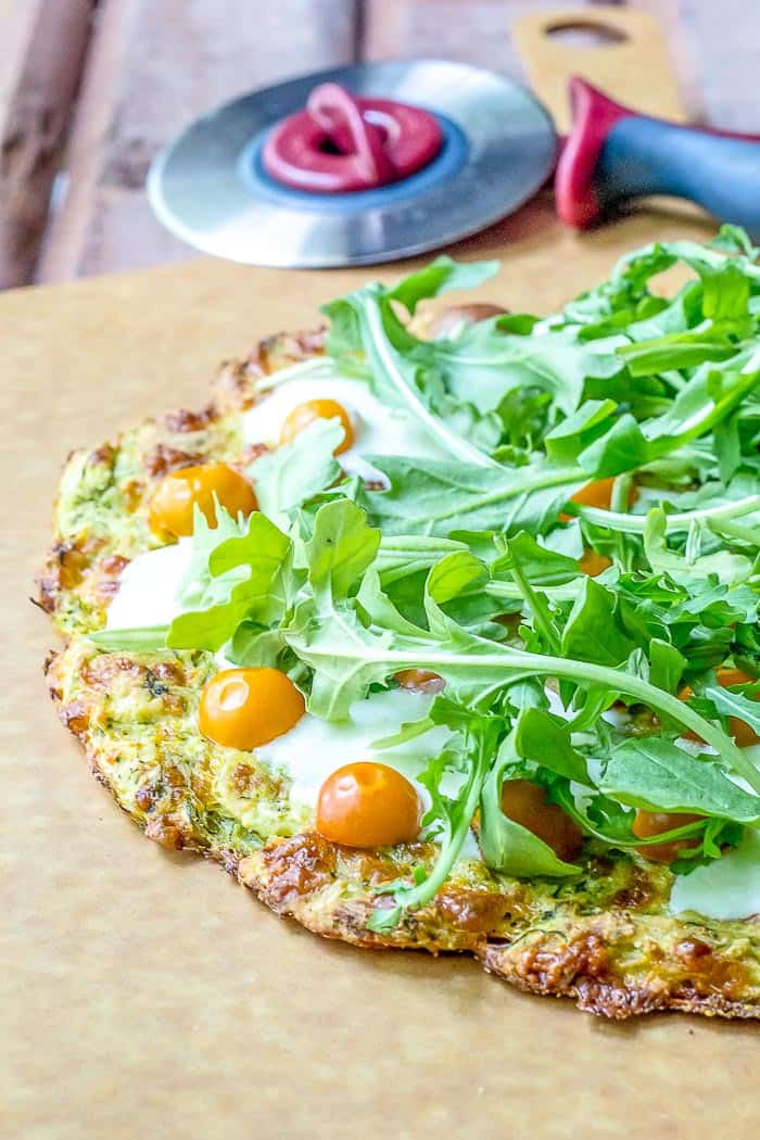 Zucchini crust pizza is gluten free but not free of flavor! It's a wonderful way to use up zucchini.