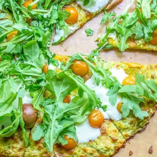Got a glut of zucchini? Use it up in this crispy gluten free zucchini crust pizza, filled with fresh herbs!