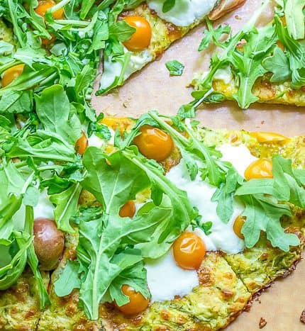 Got a glut of zucchini? Use it up in this crispy gluten free zucchini crust pizza, filled with fresh herbs!