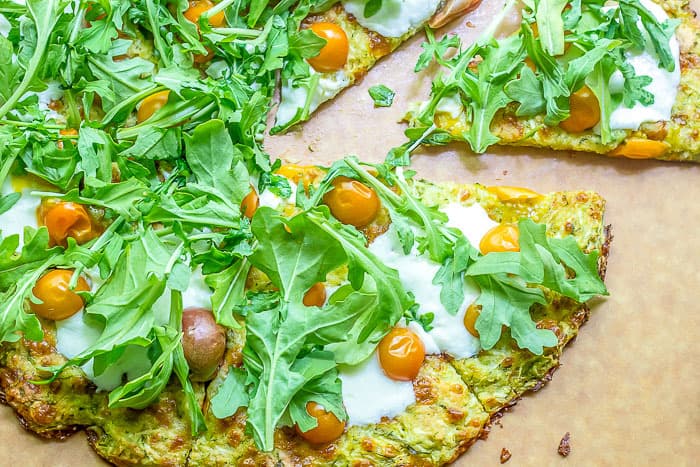 Got a glut of zucchini? Use it up in this crispy gluten free zucchini crust pizza, filled with fresh herbs!