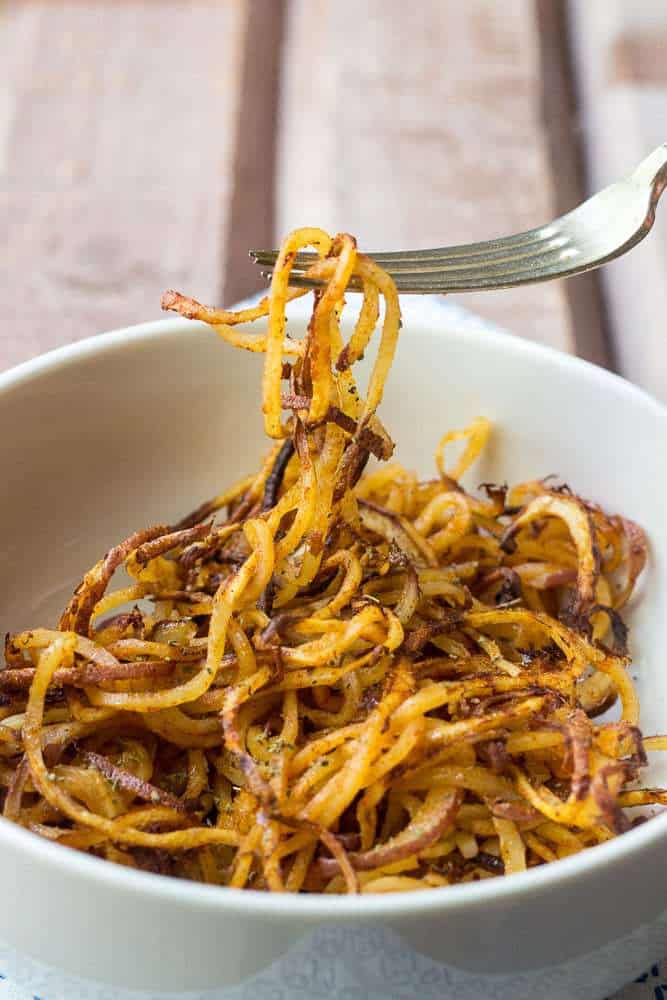 Spicy spiralized potatoes are a fun way to bring potatoes to the dinner table.