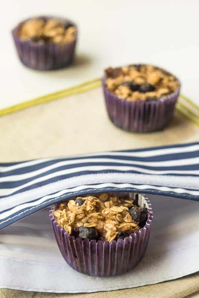 Baked Blueberry Oatmeal Cups - Make a batch of these baked blueberry oatmeal cups, and you'll have breakfast ready for the whole week.