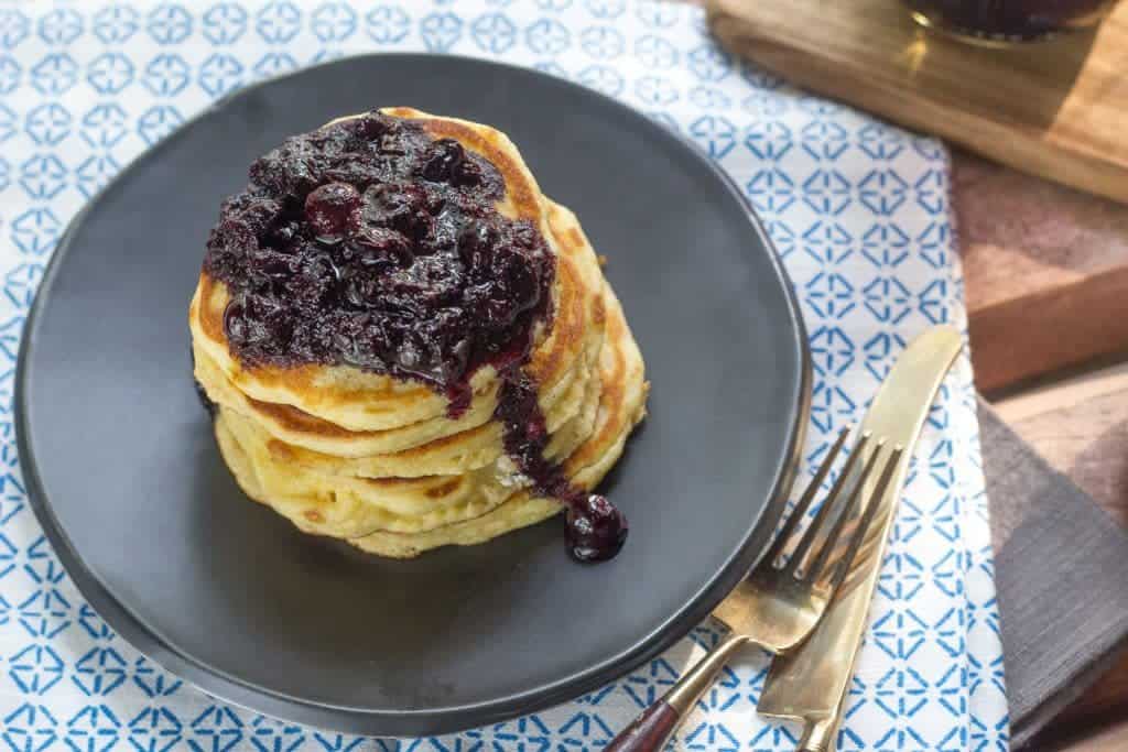 Hoe Cakes with Blueberry Jalapeno Sauce are a twist on the Southern breakfast staple.