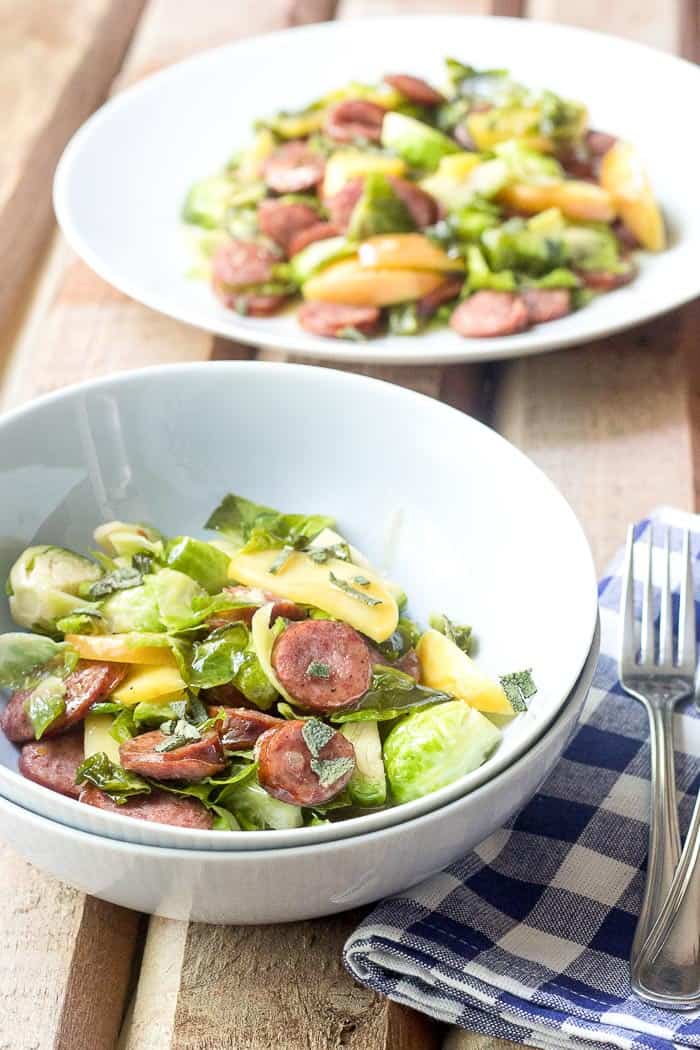 Beer-Glazed Sausage with Brussels Sprouts and Apples are the perfect dish for a cozy October night.