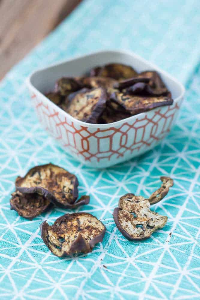 Eggplant chips are baked with spices for a healthier, satisfying snack.