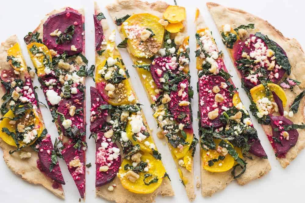Kale, Beet, and Goat Cheese Pizza is a vibrant lunch with tons of flavor.