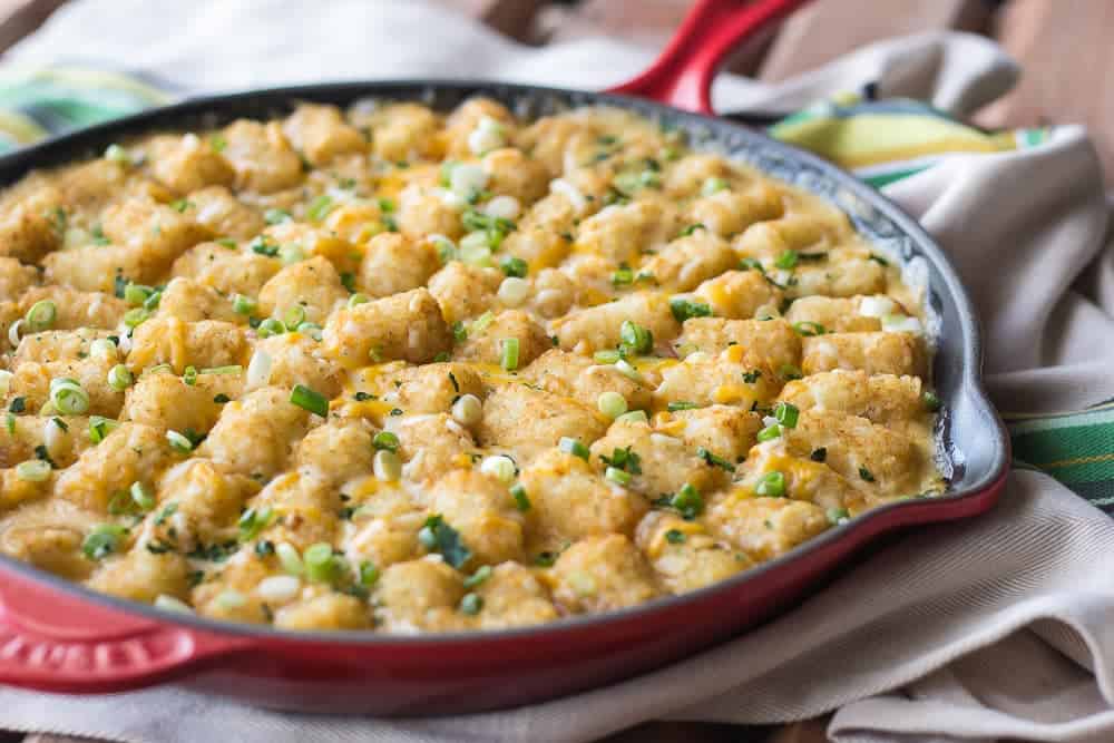 Texas Tater Tot Casserole is a cheesy, saucy dish topped with crispy potatoes.