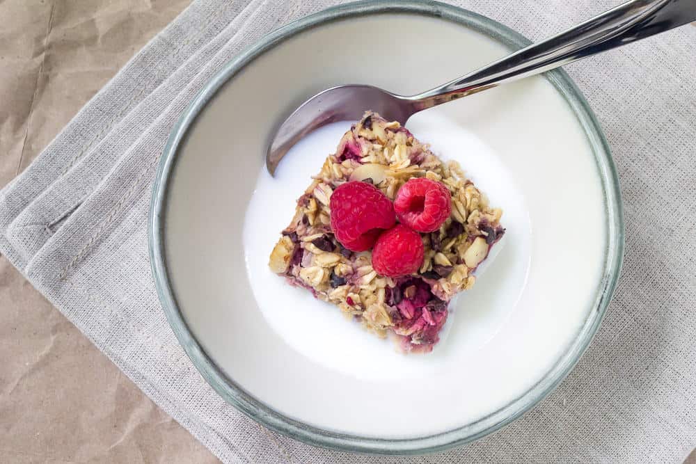 Raspberry almond baked oatmeal features cacao nibs and is a filling, make-ahead meal.