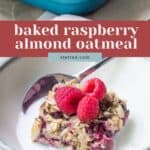 A bowl of raspberry almond baked oatmeal, topped with fresh raspberries and served with milk, sits in front of a baking dish in the background.