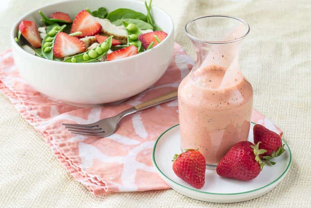 Strawberry Poppyseed Dressing is a creamy way to top your salads in the warmer months.