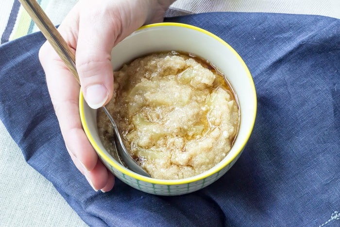 Amaranth porridge being held