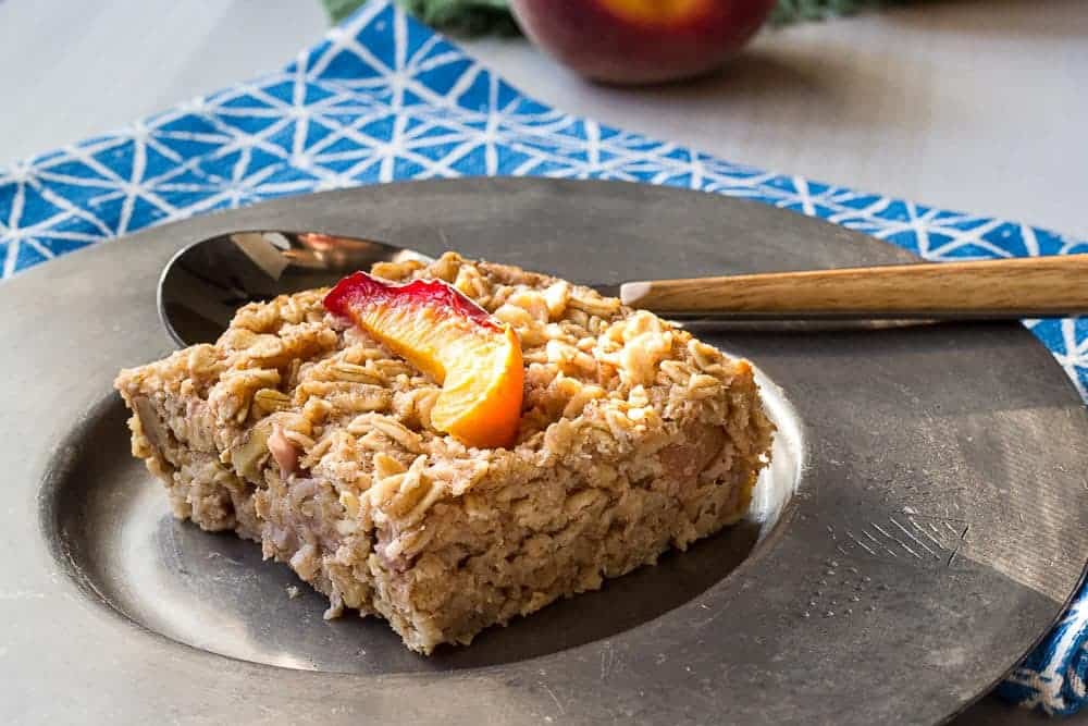 Baked peach oatmeal is easy to make to have on hand each morning. Just warm it up and you're ready to eat!