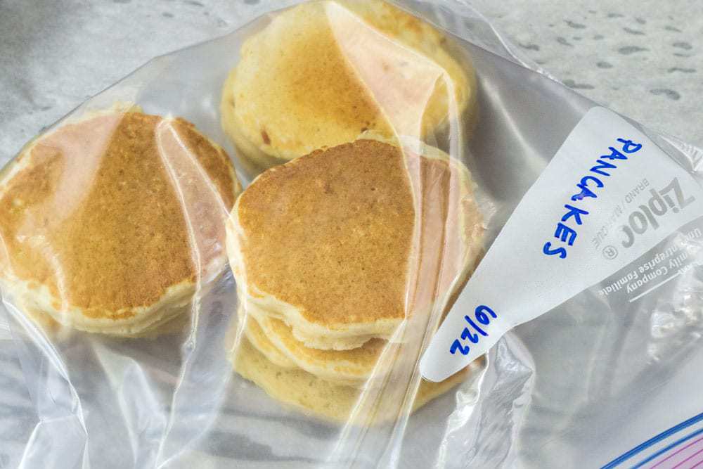 Pancakes stacked in a ziploc bag for freezing.