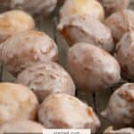 A close-up of several homemade glazed coffee donut holes on a cooling rack, with a label reading "homemade glazed donut holes" at the bottom.