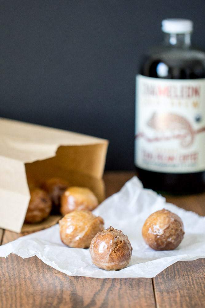 Pecan coffee donut holes are covered in a glaze made from cold-brew coffee. They're so light and fluffy!