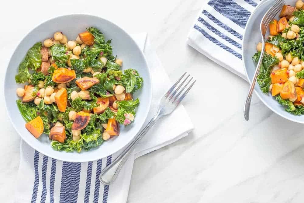 This roasted sweet potato salad wit chickpeas, kale, and a warm vinaigrette proves that salads aren't just for summer.