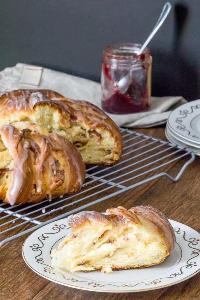 Cranberry breakfast bread uses leftover cranberry sauce for a sweet filling. This centerpiece bread is soft, buttery, and nutty.