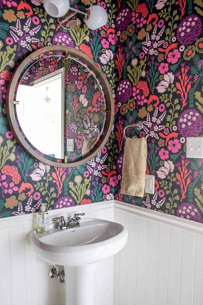 Add life to your home with powder room wallpaper. This vibrant floral paper is a hit!