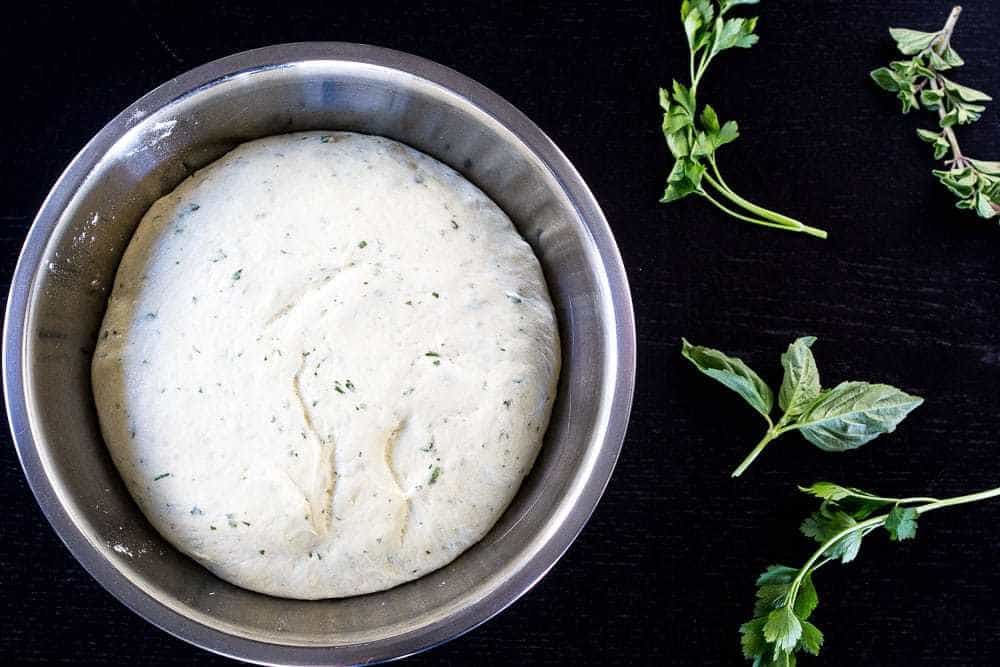 Herb pizza dough mixes up quickly. It's your new go-to dough.