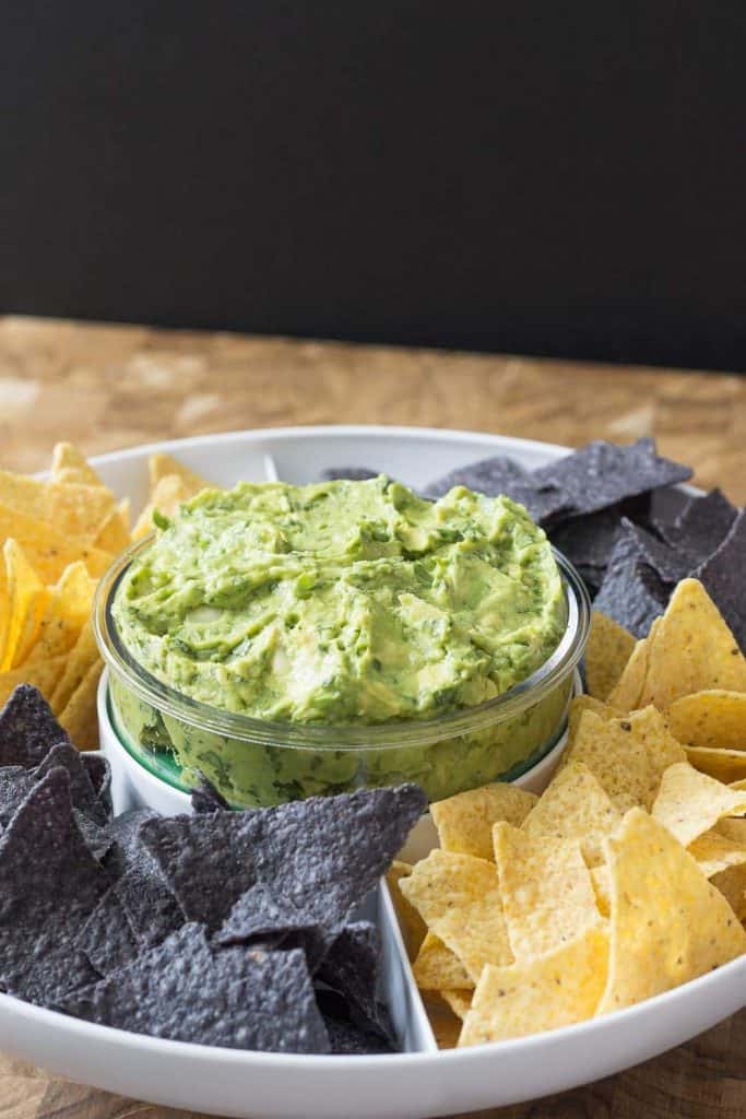 Roasted garlic guacamole is my go-to guacamole recipe! Why wait for Cinco de Mayo?