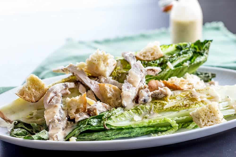 Grilled chicken Caesar salad cooks up on the grill in minutes. Even the lettuce is grilled!