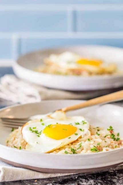 Bacon and egg risotto is made in the Instant Pot for an easy, savory breakfast.