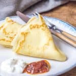 Russian crepes are light and airy, and wonderful for breakfast. Serve them with sour cream and jam for a delicious treat.