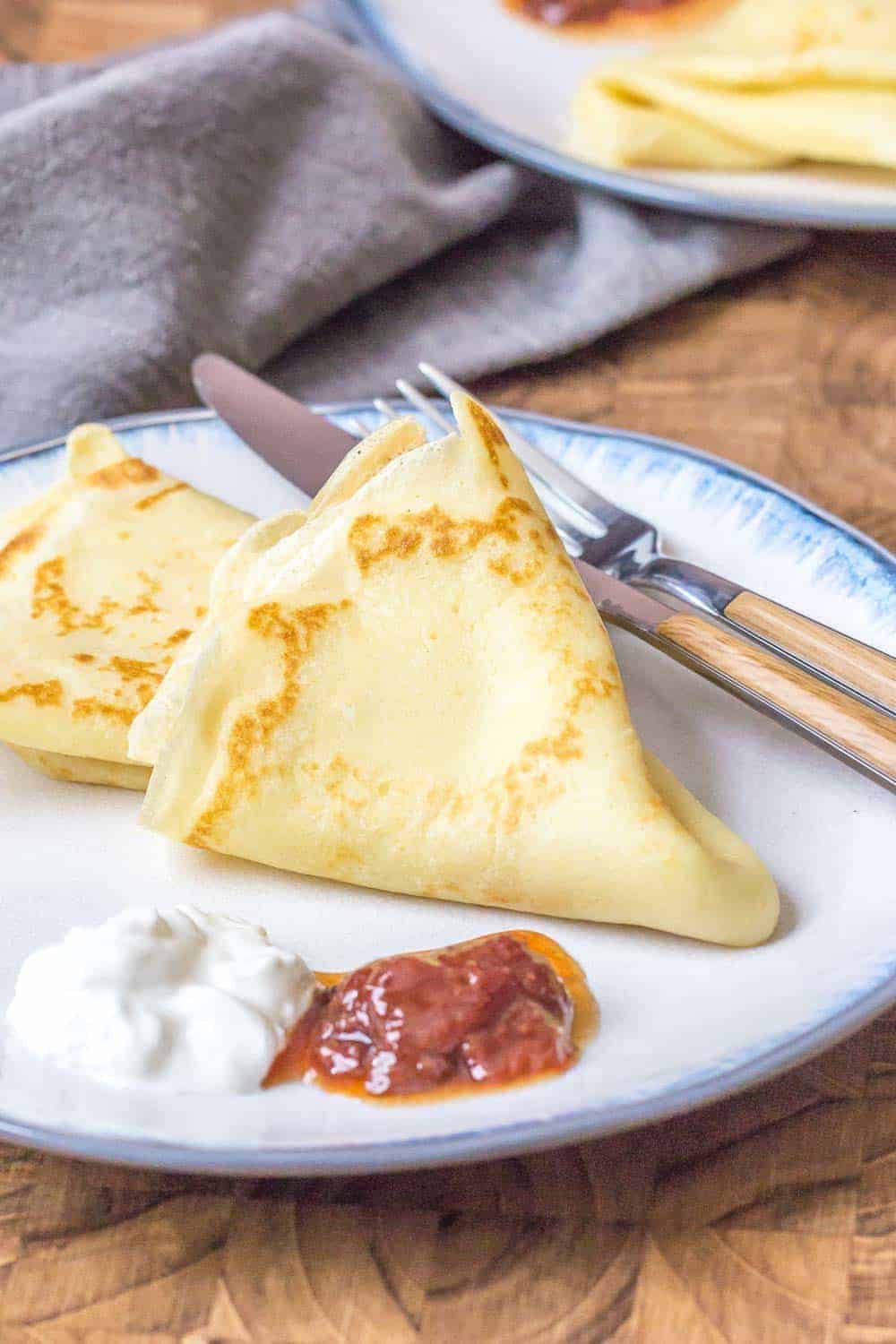 Russian crepes are light and airy, and wonderful for breakfast. Serve them with sour cream and jam for a delicious treat.