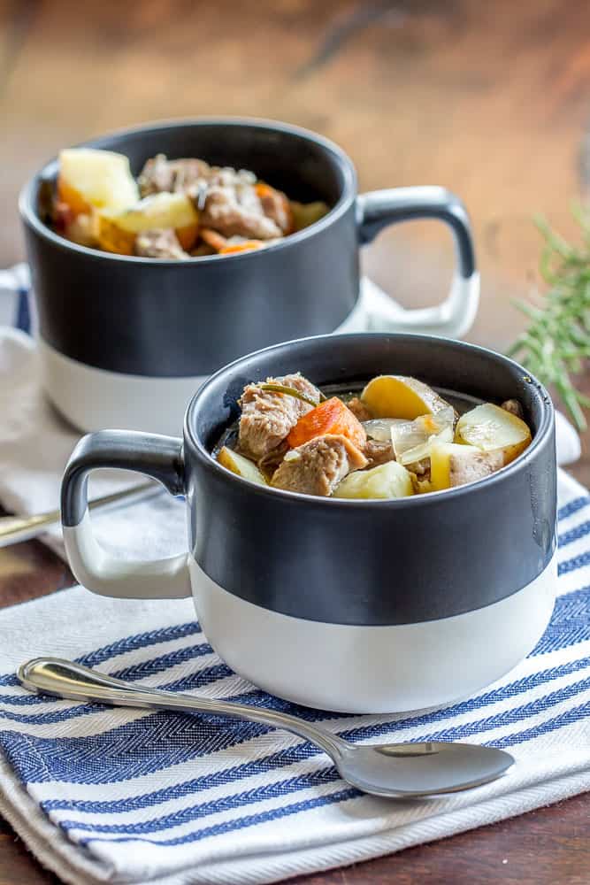 two mugs filled with lamb stew