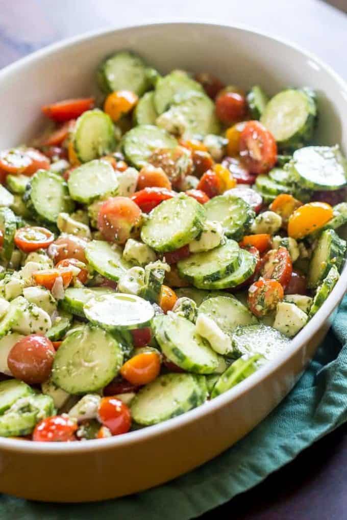 Cucumber Tomato Salad with Pesto from stetted.com on foodiecrush.com